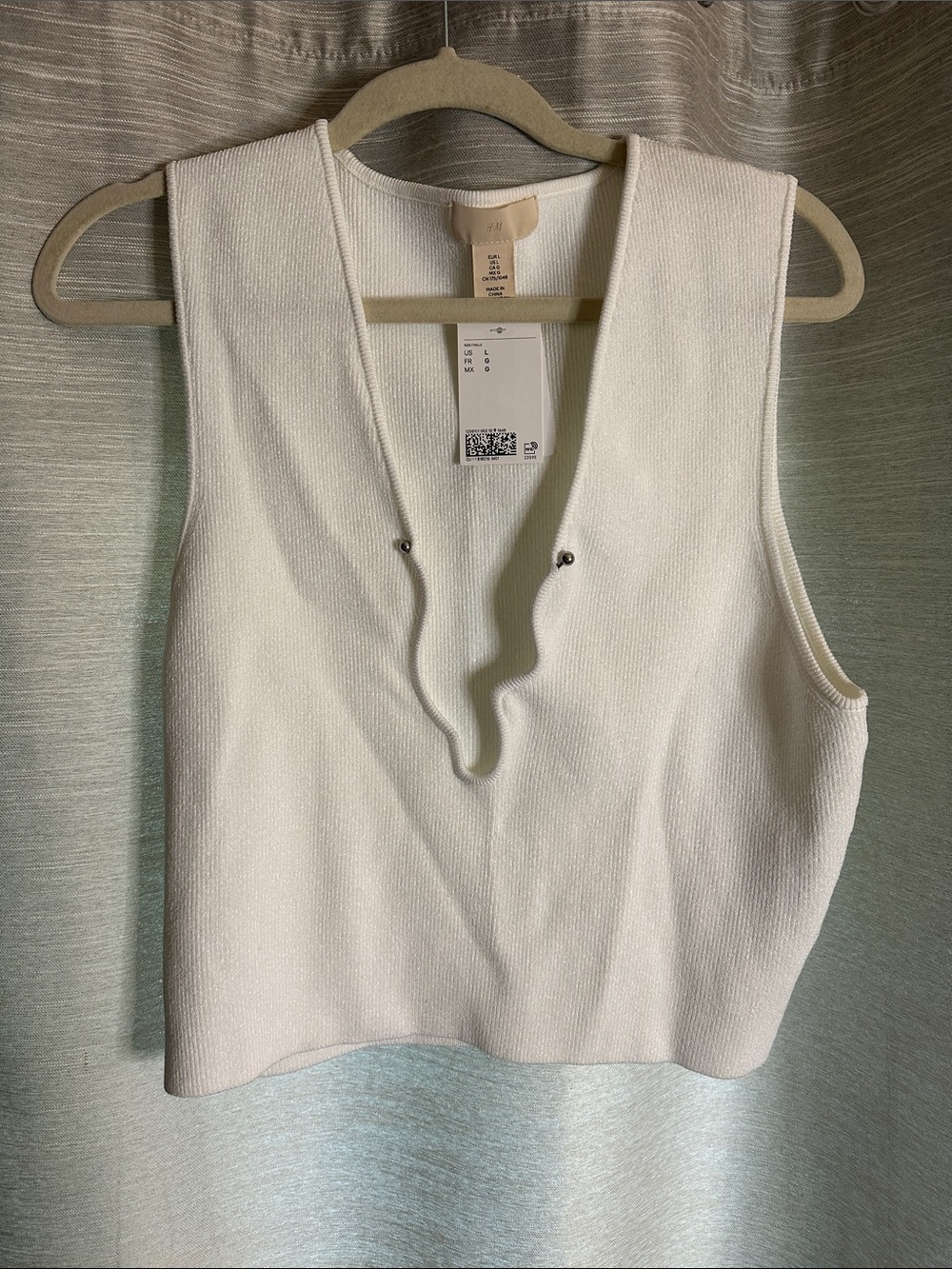 H&M sleeveless top with plunging asymmetrical neck line, and metal detail